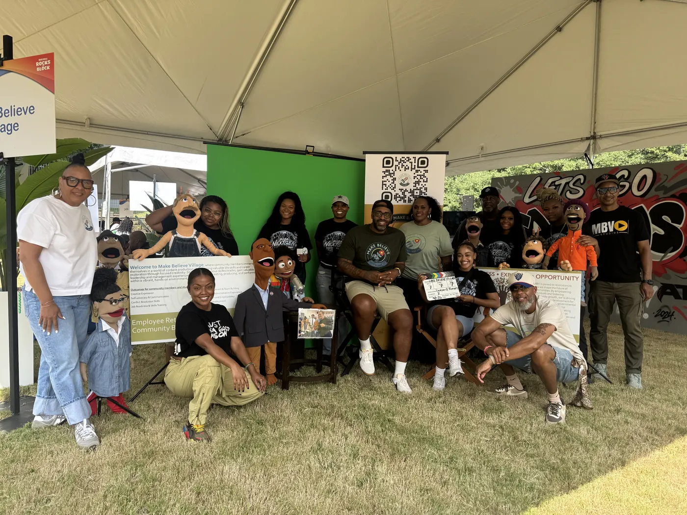 The Make Believe Village team gathered at Russell Rocks the Block